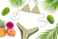 Tropical concept with pineapple, dragon and mango fruits, palm leaves with bikini swimwear on white background. Flat lay, top view Royalty Free Stock Photo