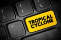 Tropical Cyclone is a rapidly rotating storm system characterized by a low-pressure center, text button on keyboard, concept