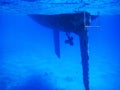 Tropical diving picture of a hull from a sailing vessel