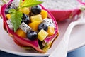 Tropical exotic salad inside a dragon fruit Royalty Free Stock Photo