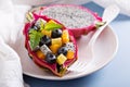 Tropical exotic salad inside a dragon fruit Royalty Free Stock Photo