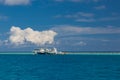 Fishing boats on the sand, the seashore against the backdrop of palm trees and blue sky. Royalty Free Stock Photo