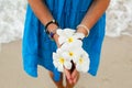 Tropical flower Plumeria in hands Royalty Free Stock Photo