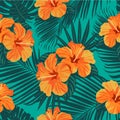 Tropical flowers and palm leaves on background. Seamless. Vector pattern.