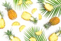 Tropical food pattern made of pineapple fruits with palm leaves on white background. Flat lay, top view. Royalty Free Stock Photo