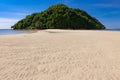 Tropical forest island at the end of paradise sand beach Royalty Free Stock Photo