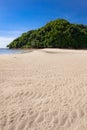 Tropical forest island at the end of paradise sand beach Royalty Free Stock Photo