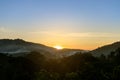 Tropical forest mountain with fog and mist in morning during sun rise at Hang Dong district in Chiang Mai, Thailand Royalty Free Stock Photo