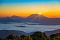 Mountain range sunrise with moving cloud mist