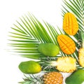 Tropical frame of pineapple and mango fruits with palm leaves on white background. Flat lay, top view Royalty Free Stock Photo