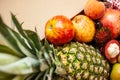 Tropical fruit in a box of pineapple, peach, mangosteen, pomegranate and rambutan. selective focus