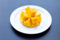 Tropical fruit, Mango on white plate on dark background Royalty Free Stock Photo