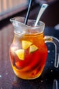 Tropical Fruit Pitcher with tea and kiwi,  orange slices,  strawberries, even lychee Royalty Free Stock Photo