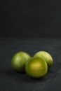 Portion of umbu, or Brazil plum, over black stone background