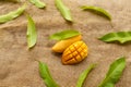 Mango slice and fruit on brown linen cloth background