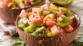 Tropical Fruit Salad in Coconut Bowls on Wooden Table Royalty Free Stock Photo