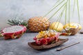 Tropical fruit salad served in half of dragon fruit on gray background. Word love made of cookie letters on top.  Healthy food Royalty Free Stock Photo