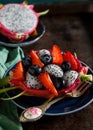 Tropical fruit salad served inside a dragon fruit. Royalty Free Stock Photo