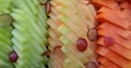 Tropical fruit slices background. Melon, papaya and grape ready to eat Royalty Free Stock Photo