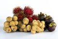 Tropical fruits arranged on isolated white background. Consist of Rambutan, Mangosteen, and Longkong or Lansium parasiticum fruits