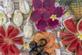 Tropical fruits assortment, closeup, top view. Many colorful ripe fruits background. Durian, papaya, watermelon, banana,