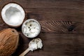 Tropical fruits with broken coconut on wooden background top view space for text