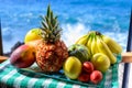 Tropical fruits collection, custard apple or green ripe cherymoia, passion fruit, pineapple, mango, tamarillo, banana exotic Royalty Free Stock Photo