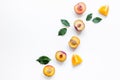 Tropical fruits design with orange and peach on white table background top view mock up Royalty Free Stock Photo