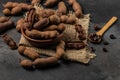 Tropical fruits, Tamarindo beans in shell on a brown butchers block on a dark background, healthy fruit. banner, menu, recipe Royalty Free Stock Photo