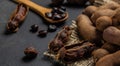 Tropical fruits, Tamarindo beans in shell on a brown butchers block on a dark background, healthy fruit. banner, menu, recipe Royalty Free Stock Photo