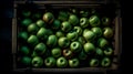 Tropical fruits in a wooden box: mango, dragon fruit, lime,