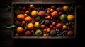 Tropical fruits in a wooden box: mango, dragon fruit, lime,