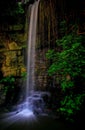 Tropical garden with serene waterfall Royalty Free Stock Photo