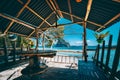 Tropical getaway remote panorama of impressive Pinagbuyutan island from the native wood and bamboo terrace, beauty of Royalty Free Stock Photo