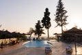 Tropical greek pool sunset tourist hotel luxury Royalty Free Stock Photo