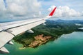 Tropical group of islands in Thailand as seen on window through window of an aicraft. Top view