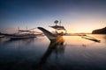 Tropical harbor bay in evening. Golden hour in lagoon in Philippines, Palawan, El Nido. Sunset on beach. Tranquil scenic Royalty Free Stock Photo