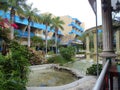 Tropical hotel with lush gardens and fountain