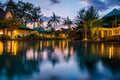 Tropical hotel with swimming pool at night with reflections and palms, Gili Trawangan, Lombok, Indonesia Royalty Free Stock Photo