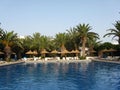 Tropical hotel swimming pool Royalty Free Stock Photo