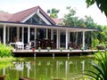 Tropical house veranda & natural pond Royalty Free Stock Photo