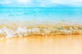 Tropical island beach nature, blue sea wave splash closeup, turquoise ocean water, yellow golden sand, sun, sky, white clouds Royalty Free Stock Photo