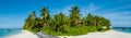 Tropical island beach panorama view with palm trees at Maldives Royalty Free Stock Photo