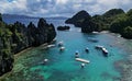 Tropical island with boats in lagoons Royalty Free Stock Photo