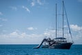 Tropical island in the Great Barrier Reef. coral reef, with yachts sailing. Boats and super yachts on holiday. Voyages travelling Royalty Free Stock Photo