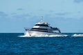 Tropical island in the Great Barrier Reef. coral reef, with yachts sailing. Boats and super yachts on holiday. Voyages travelling Royalty Free Stock Photo