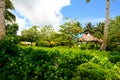 Tropical island jungle in Oceania with traditional primitive architecture of Polynesian aborigines