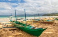 Tropical island landscape with bangca traditional philippines boats left at the shore, Puerto Princessa, Palawan