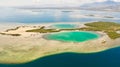 Tropical island with mangroves and turquoise lagoons on a coral reef, top view.Fraser Island, seascape Honda Bay