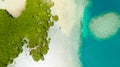 Tropical island with mangroves and turquoise lagoons on a coral reef, top view.Fraser Island, seascape Honda Bay